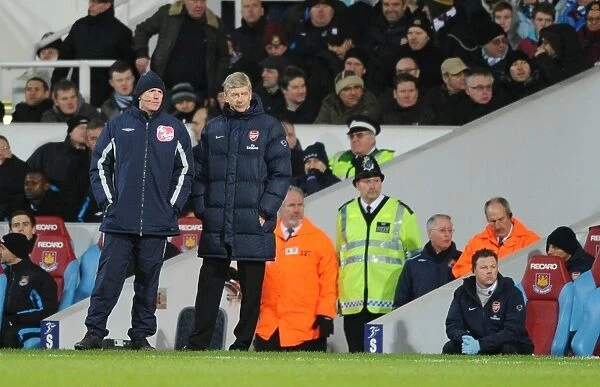 Arsenal manager Arsene Wenger with Fourth Official Peter Walton. West Ham United 1