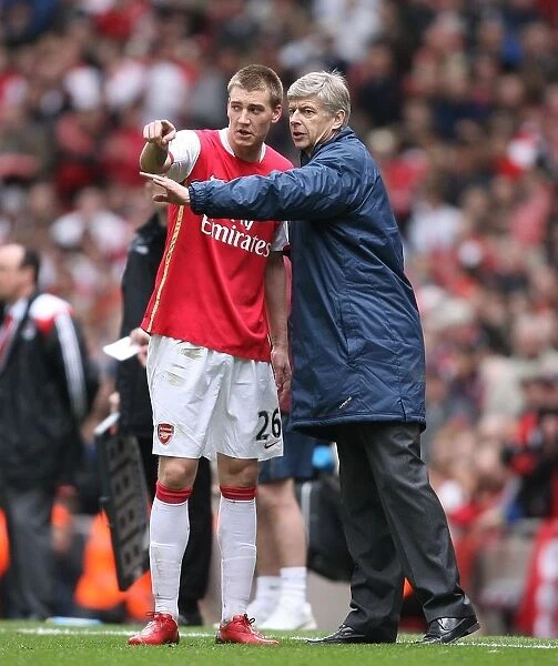 Arsenal manager Arsene Wenger with Nicklas Bendtner during the match