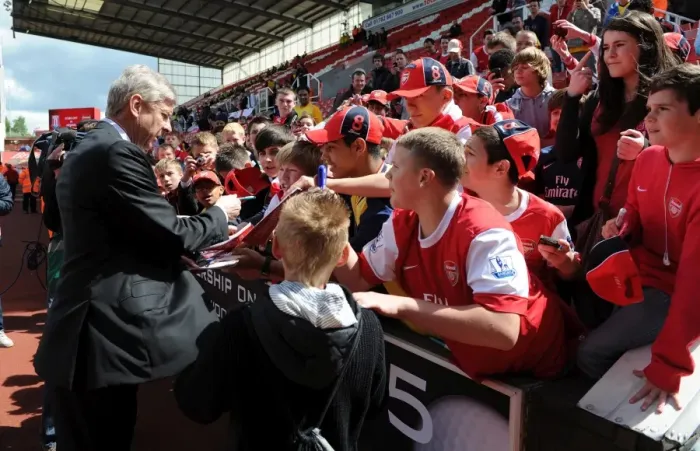 Framed Print : Arsenal manager Arsene Wenger signs autographs for the fans. Stoke City 3: 1 Arsenal