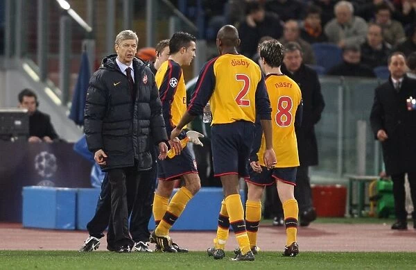 Arsenal manager Arsene Wenger talks with Abou Diaby