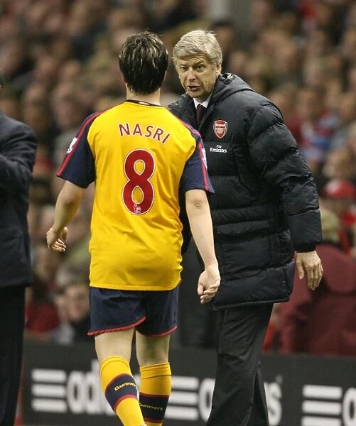 Arsenal manager Arsene Wenger talks with Samir Nasri