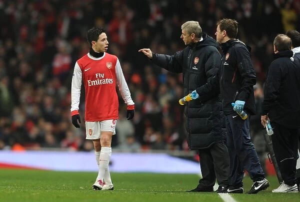 Arsenal manager Arsene Wenger talks with Samir Nasri. Arsenal 0: 0 Manchester City