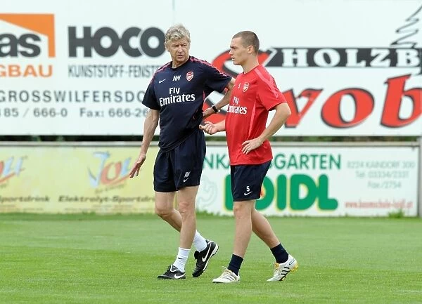 Arsenal manager Arsene Wenger with Thomas Vermaelen. Arsenal Training Camp