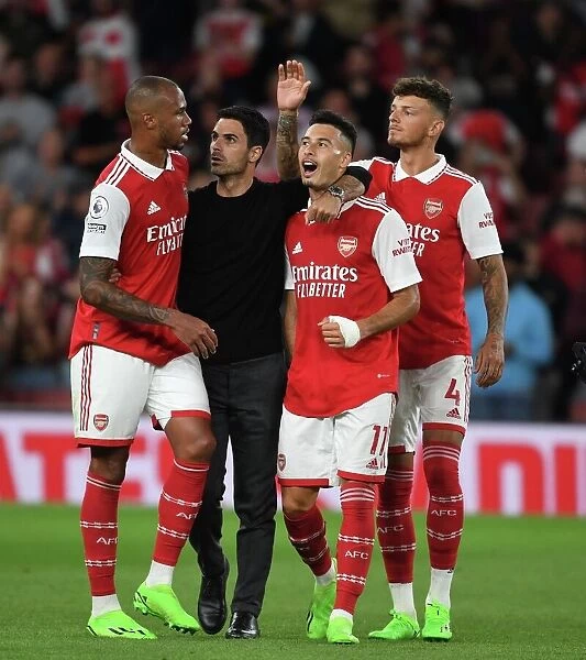 Arsenal Manager Mikel Arteta Celebrates with Gabriel, Martinelli, and White after Arsenal's Victory over Aston Villa (2022-23)