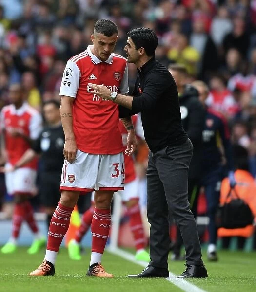 Arsenal Manager Mikel Arteta Conferencing with Granit Xhaka during Arsenal vs. Tottenham, 2022-23 Premier League