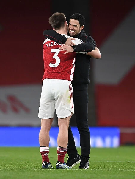 Arsenal Manager Mikel Arteta Embraces Kieran Tierney After Arsenal vs. Tottenham Hotspur Match, 2020-21 Premier League