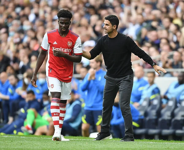 Arsenal Manager Mikel Arteta Guides Bukayo Saka during Tottenham-Arsenal Pre-Season Clash