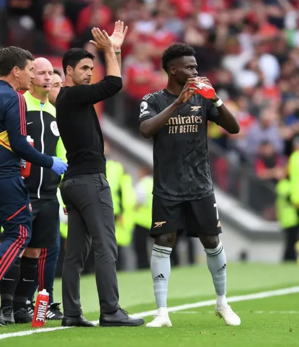 Framed Print : Arsenal Manager Mikel Arteta Guides Bukayo Saka at Manchester United's Old Trafford (Premier League 2022-23)