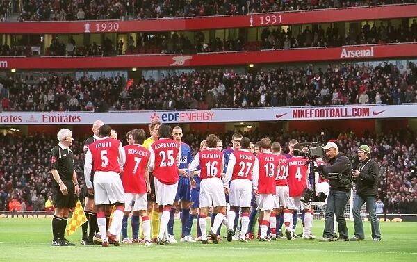 The Arsenal and Manchester United shake hands before the match