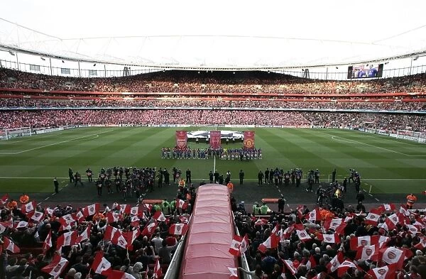 The Arsenal and Manchester United teams line up before the match