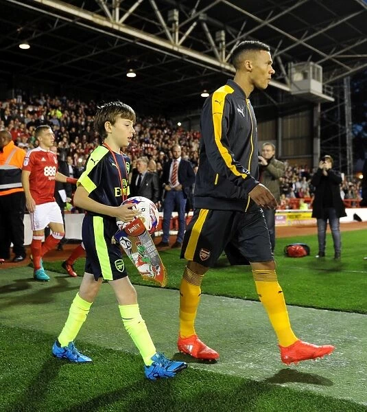 The Arsenal mascot walks out with Kieran Gibbs (Arsenal). Nottingham Forest 0:4 Arsenal