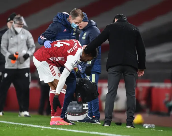 Framed Print : Arsenal: Mikel Arteta Tends to Injured Aubameyang Amid Leeds United Clash