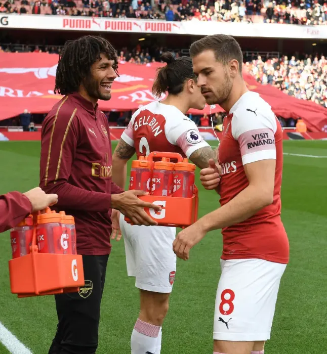 Framed Print : Arsenal: Mohamed Elneny Sharing Water with Aaron Ramsey Before Arsenal v Everton Match, 2018-19