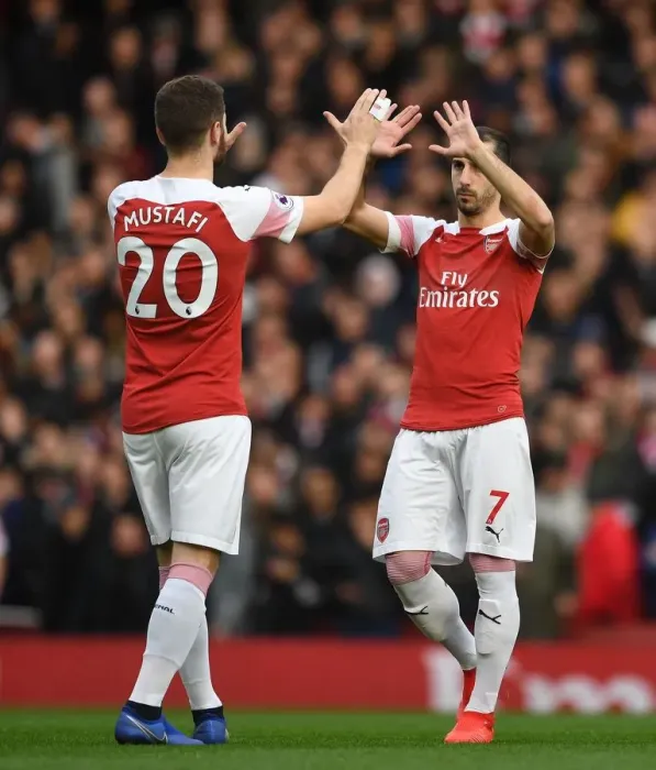 Framed Print : Arsenal: Mustafi and Mkhitaryan's High-Five Moment before the Battle against Tottenham