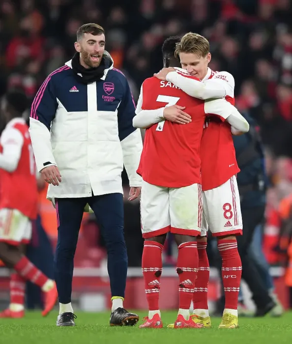 Framed Print : Arsenal: Odegaard and Saka Embrace Victory After Beating Manchester United