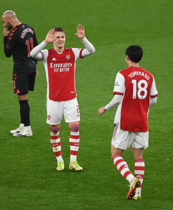 Framed Print : Arsenal: Odegaard and Tomiyasu Celebrate Victory Over Southampton (Premier League 2021-22)