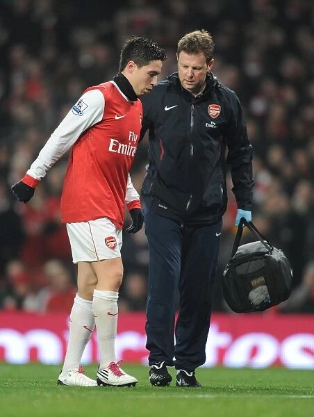 Arsenal physio Colin Lewin treats Samir Nasri. Arsenal 0:0 Manchester City