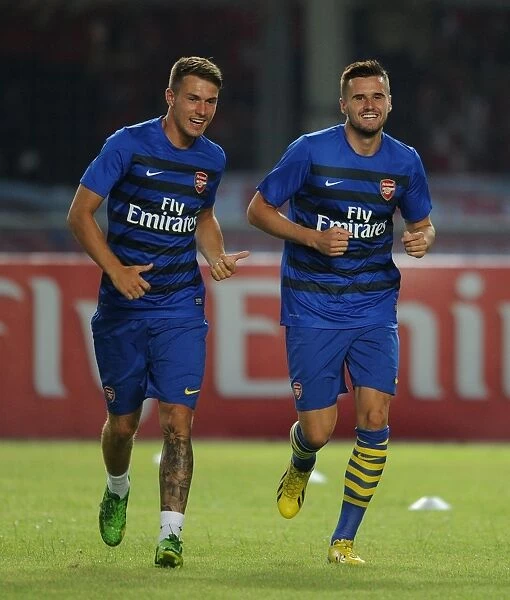 Arsenal Players Aaron Ramsey and Carl Jenkinson Warm Up Ahead of Indonesia All-Stars Match