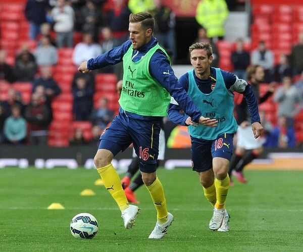 Arsenal Players Aaron Ramsey and Nacho Monreal Gearing Up for Manchester United Showdown (2014-15)