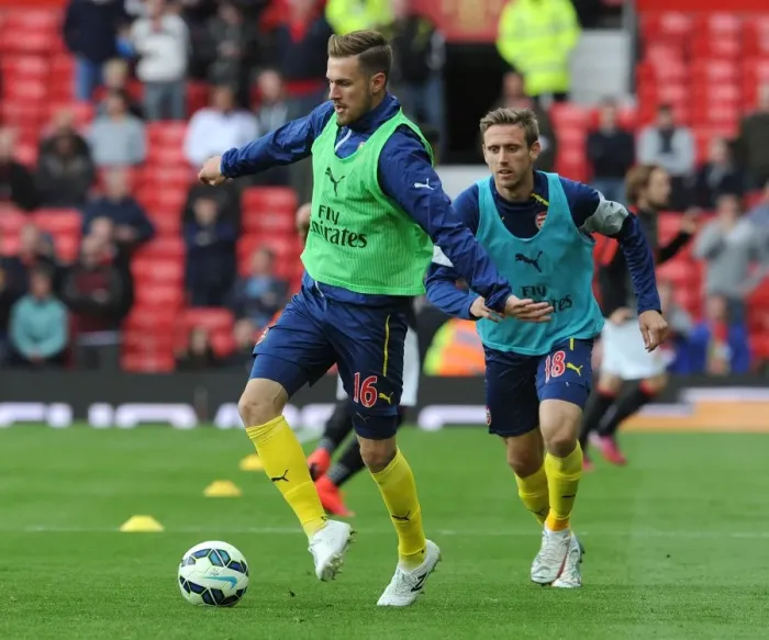 Framed Print : Arsenal Players Aaron Ramsey and Nacho Monreal Gearing Up for Manchester United Showdown (2014-15) Framed Print : Arsenal Players Aaron Ramsey and Nacho Monreal Gearing Up for Manchester United Showdown (2014-15)