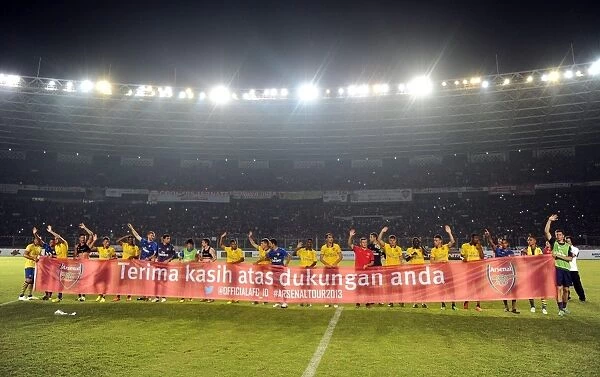 Arsenal Players Show Appreciation with Banner to Indonesian Fans