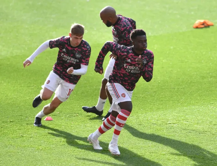 Framed Print : Arsenal Players Bukayo Saka and Emile Smith Rowe Warm Up Ahead of Arsenal v Watford (2021-22)