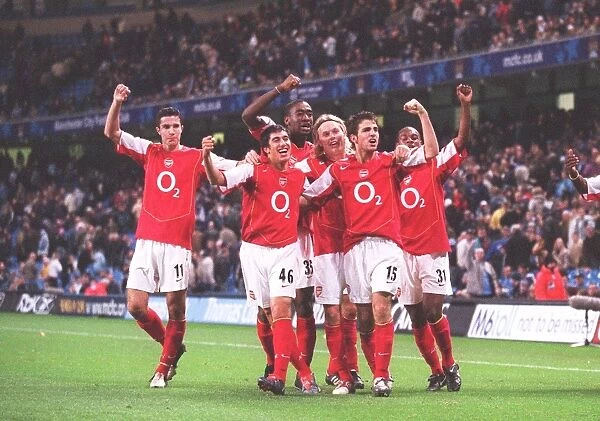The Arsenal players celebrate the 2nd goal scored by Danny Karbassiyoon