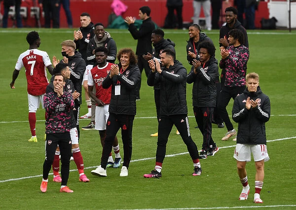 Arsenal Players Celebrate with Fans After Securing Victory Against Brighton & Hove Albion (2020-21)