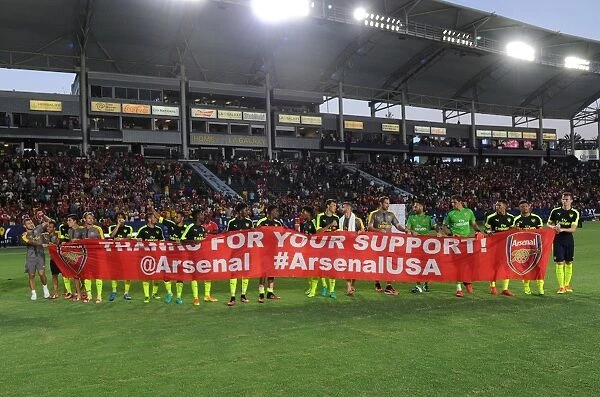Arsenal Players Celebrate with Thank You Banner after Arsenal v Chivas Match, 2016