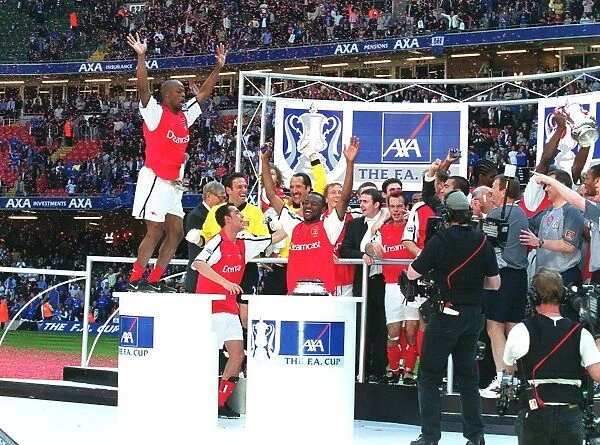Arsenal players celebrate after winning the FA Cup