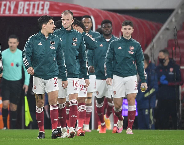Arsenal Players Hector Bellerin, Rob Holding, and Kieran Tierney Prepare for Arsenal v Aston Villa in Empty Emirates Stadium (2020-21)