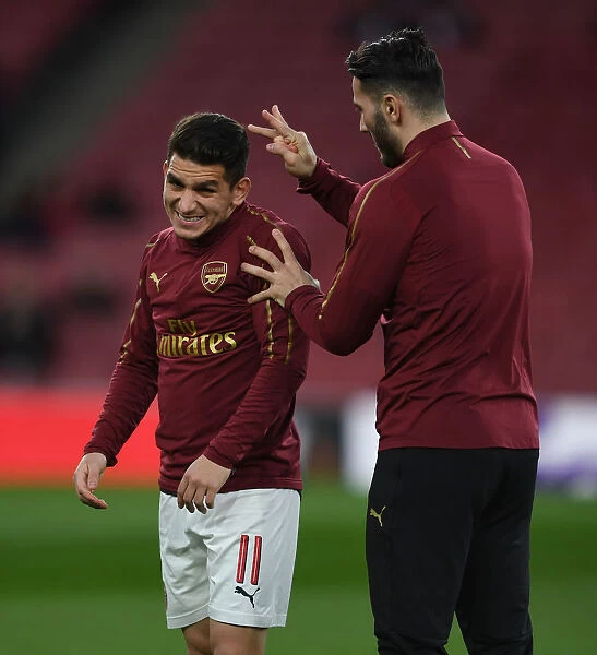 Arsenal Players Lucas Torreira and Sead Kolasinac Warm Up Ahead of Arsenal v BATE Borisov UEFA Europa League Clash