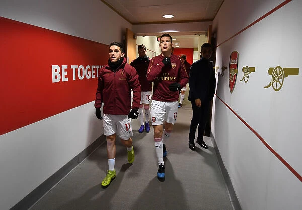 Arsenal Players Lucas Torreira and Stephan Lichtsteiner Warming Up Ahead of Arsenal v Cardiff City, Premier League 2018-19