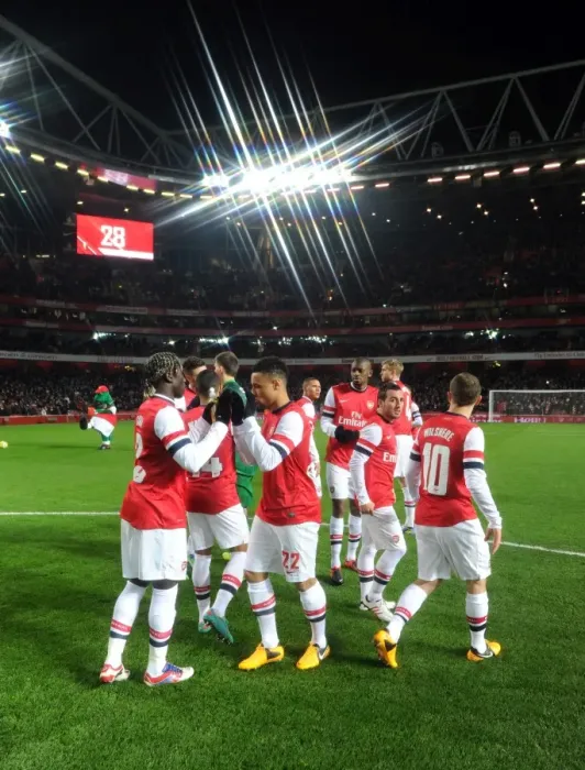 Framed Print : Arsenal players before the match. Arsenal 1: 0 Swansea City. FA Cup 3rd Round replay