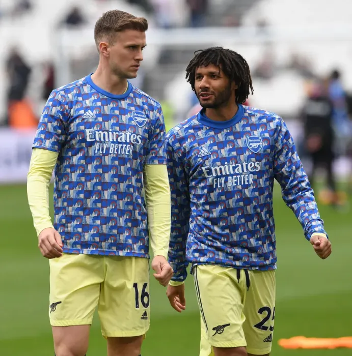 Framed Print : Arsenal Players Mohamed Elneny and Rob Holding Warm Up Ahead of West Ham United Clash (Premier League 2021-22)