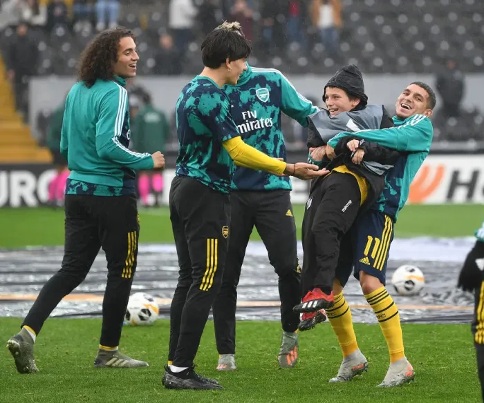 Framed Print : Arsenal Players Share Pre-Match Fun with Ballboy Ahead of Vitoria Guimaraes Clash, UEFA Europa League 2019-20