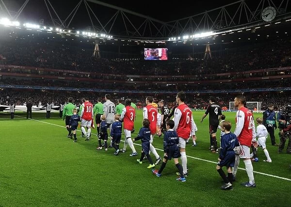 The Arsenal players walk out onto the pitch before the match. Arsenal 3: 0 AC Milan