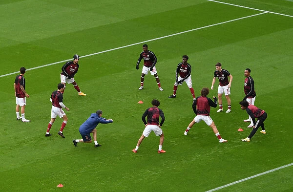 Arsenal Players Warm Up Ahead of Arsenal v Sheffield United in 2020-21 Premier League