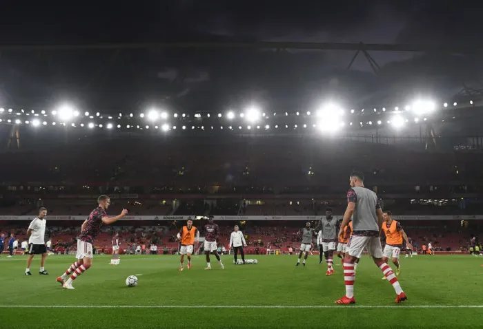 Framed Print : Arsenal Players Warm Up Ahead of Carabao Cup Clash Against AFC Wimbledon