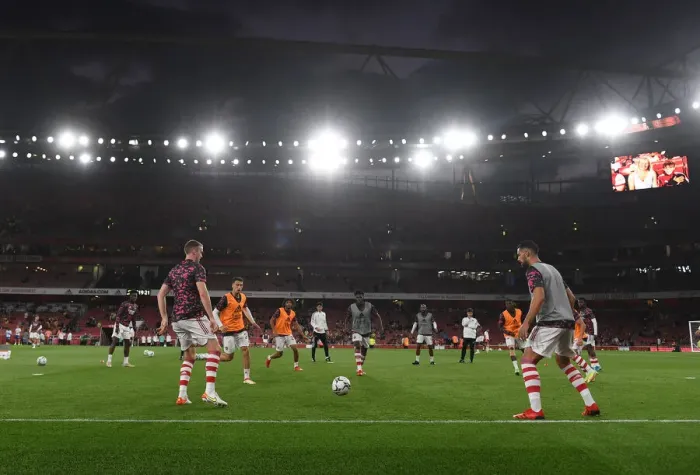 Framed Print : Arsenal Players Warm Up Ahead of Carabao Cup Clash vs. AFC Wimbledon
