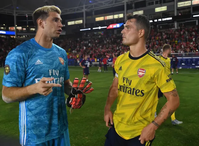 Framed Print : Arsenal Pre-Season: A Heartfelt Moment Between Emi Martinez and Granit Xhaka After Arsenal vs. Bayern Munich