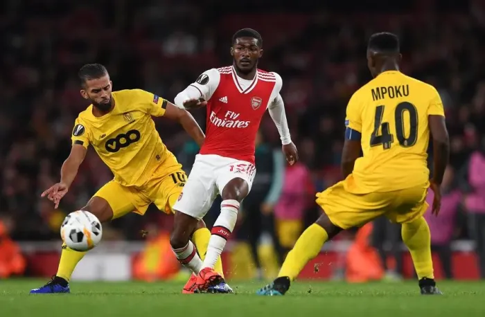 Framed Print : Arsenal Under Pressure: Ainsley Maitland-Niles Faces Off Against Mehdi Carcela in Europa League Clash Framed Print : Arsenal Under Pressure: Ainsley Maitland-Niles Faces Off Against Mehdi Carcela in Europa League Clash