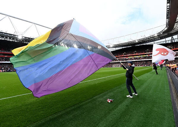 Arsenal Pride Night: A Sea of Rainbow Flags at Emirates Stadium during Arsenal vs. Brentford, Premier League 2021-22