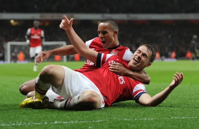 Framed Print : Arsenal: Ramsey and Walcott's Euphoric Goal Celebration (2012-13) vs Wigan Athletic Framed Print : Arsenal: Ramsey and Walcott's Euphoric Goal Celebration (2012-13) vs Wigan Athletic