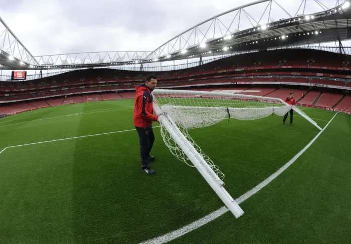 Framed Print : Arsenal Readies the Field: Groundsman Sets Up Goals for Sunderland Showdown