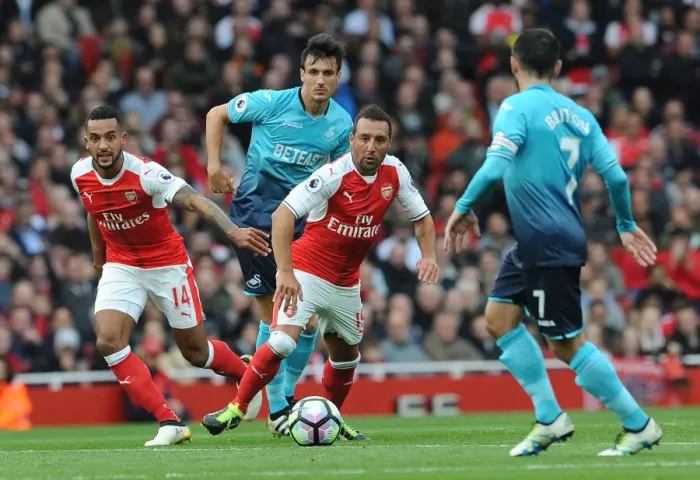 Framed Print : Arsenal Rivals Clash: Walcott vs Cazorla in Intense Premier League Battle Framed Print : Arsenal Rivals Clash: Walcott vs Cazorla in Intense Premier League Battle