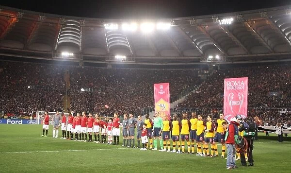 Arsenal and Roma teams line up before the match