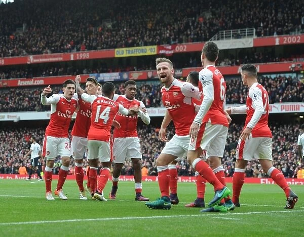 Arsenal Stars: Celebrating a Goal Against Tottenham in the Intense 2016-17 Premier League Clash