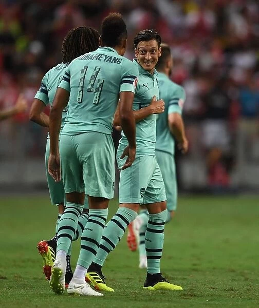 Arsenal Stars Ozil and Aubameyang Celebrate Goal Against Paris Saint-Germain, 2018