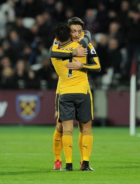 Arsenal Stars: Ozil and Sanchez Celebrate Goal vs. West Ham United, 2016-17